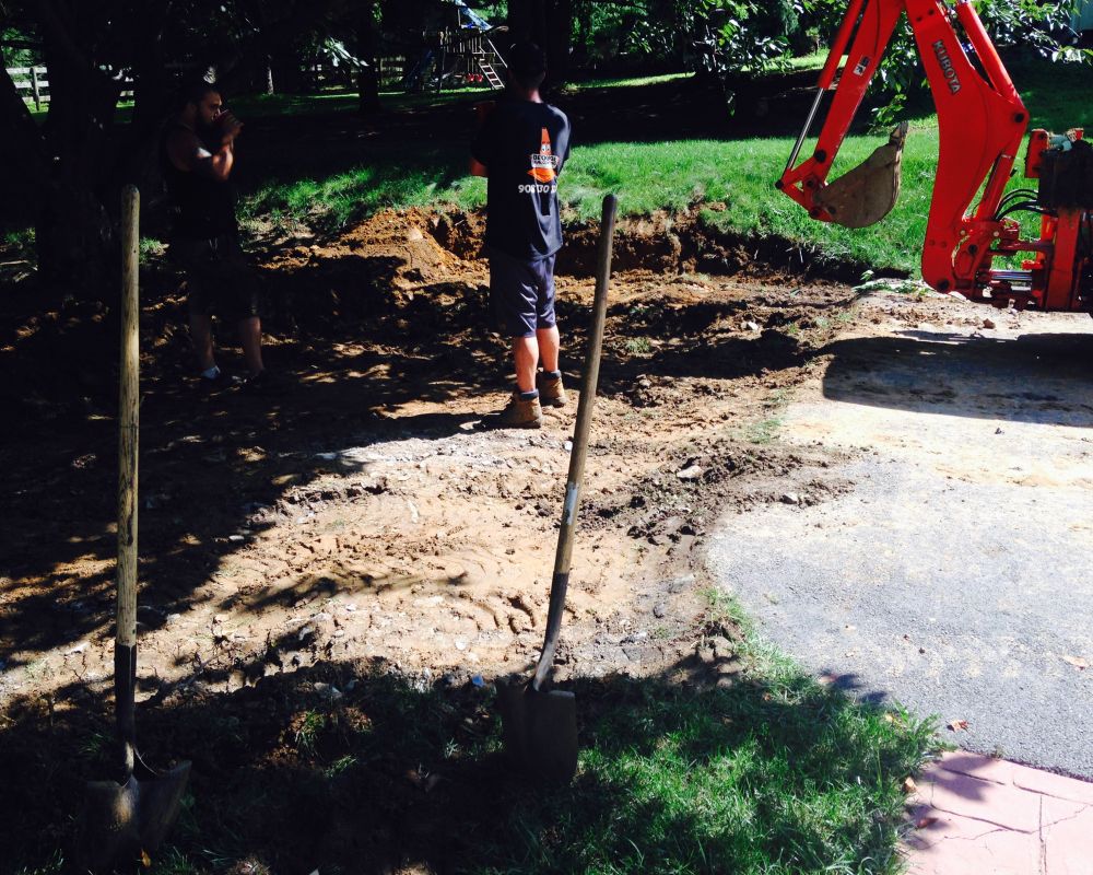 Flattening Soil for Driveway Extension